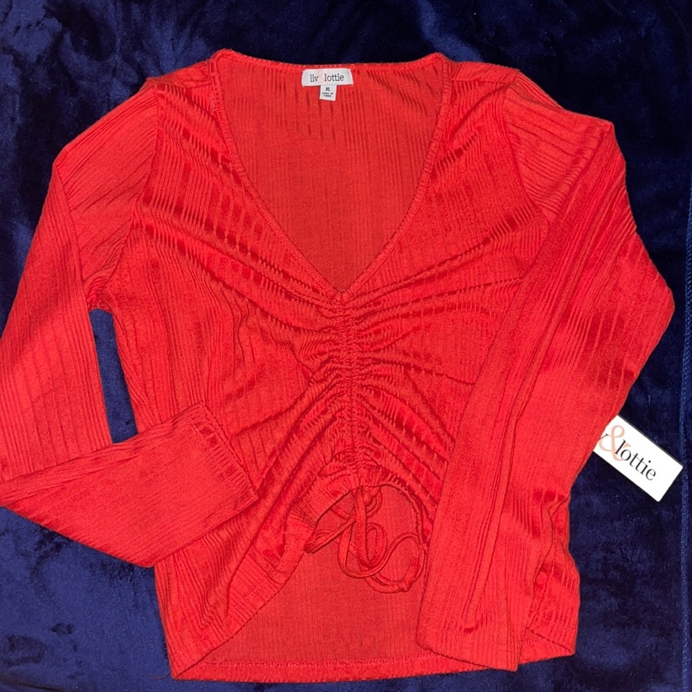 This is a liv and lottie red long sleeve shirt.